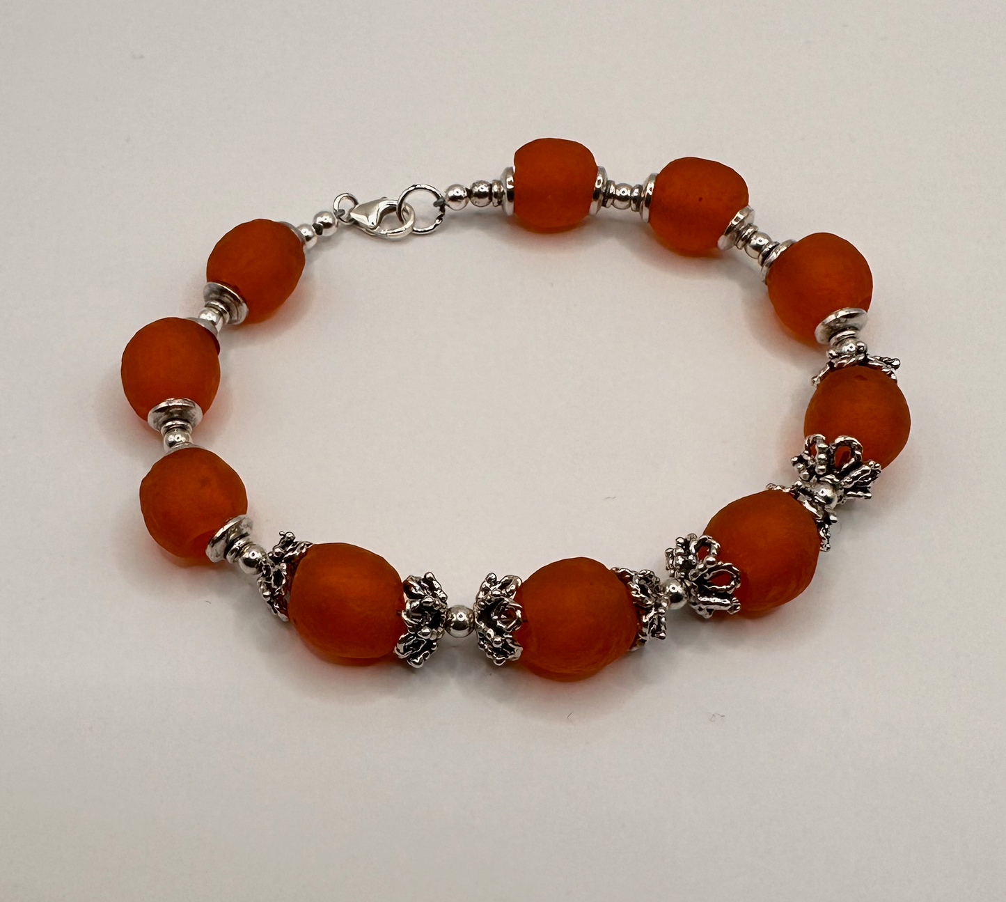 African Orange Recycle Bead with Sterling Silver Accent Bead Bracelet