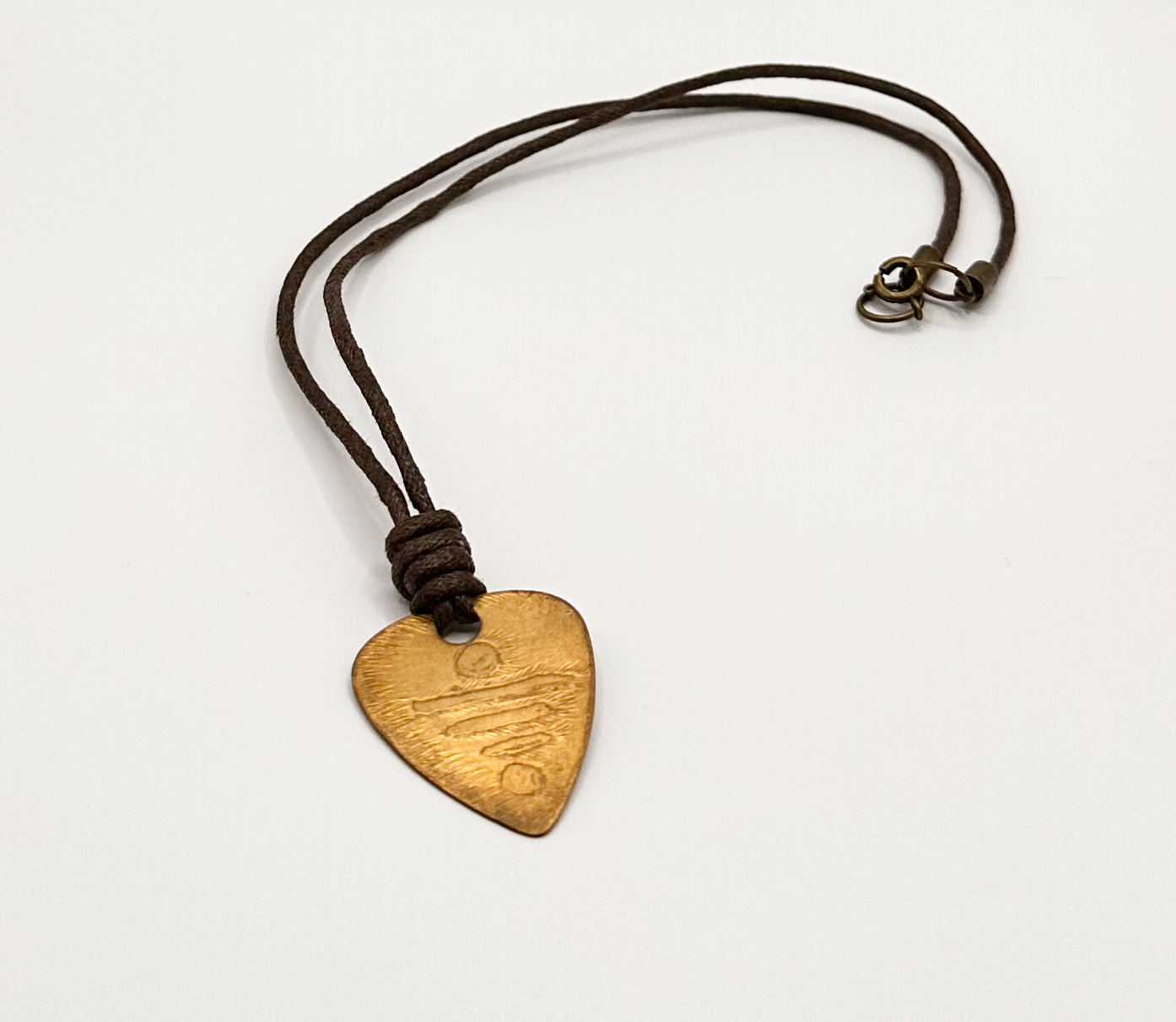 Brass Guitar Symbol Pick Pendant with an Etched  Contemporary Design
